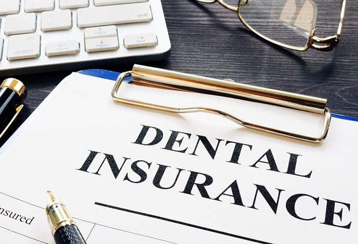 Dental insurance form on a clipboard