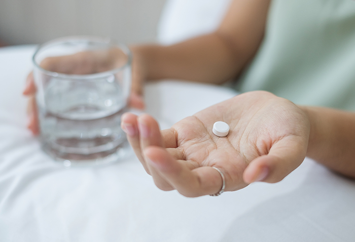 Person taking a pill