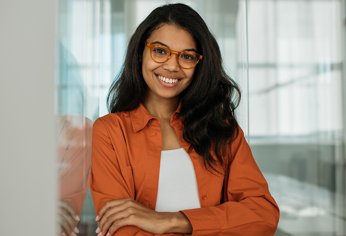 Smiling woman in business casual attire in an office